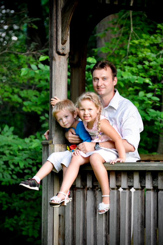 Family portrait by a garden arch